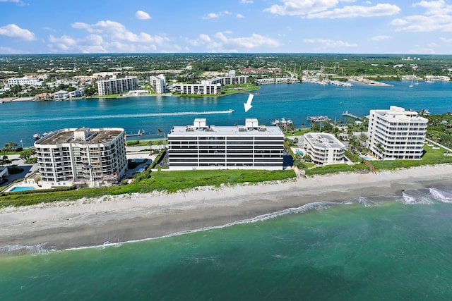 aerial view featuring a water view and a beach view