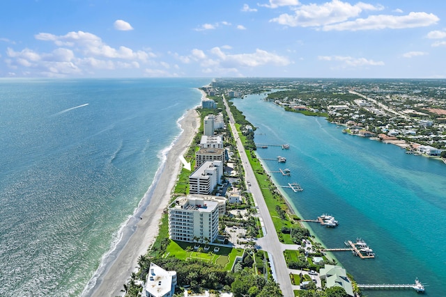 bird's eye view featuring a water view and a view of the beach