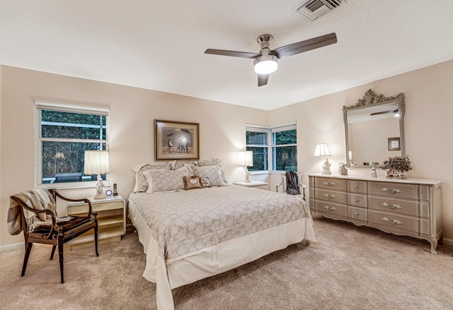 bedroom featuring ceiling fan and light colored carpet