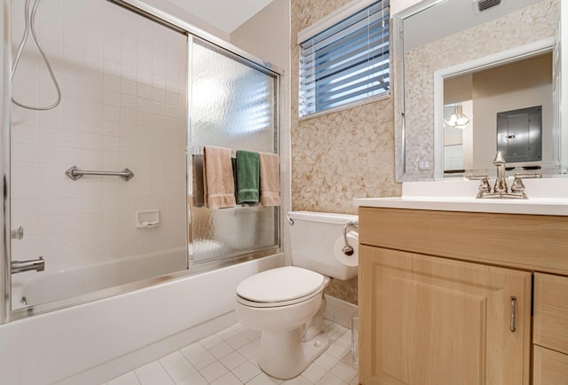 full bathroom featuring toilet, vanity, tile patterned floors, and combined bath / shower with glass door