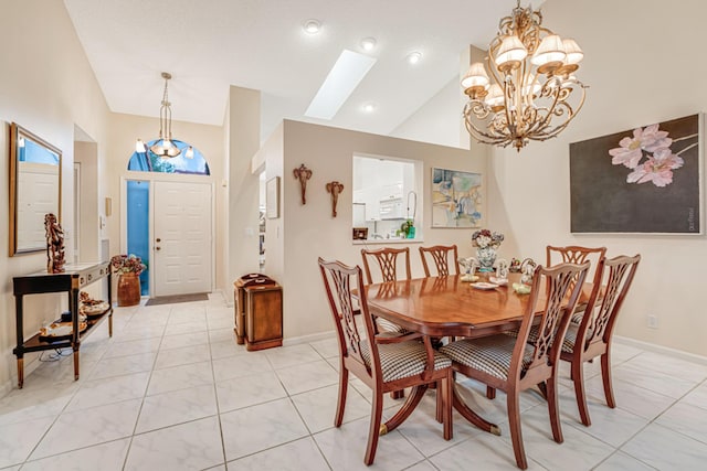 dining area with high vaulted ceiling