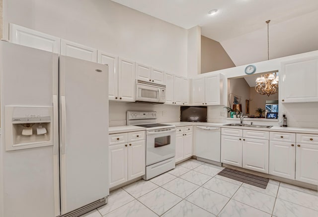 kitchen with pendant lighting, sink, white appliances, and white cabinets