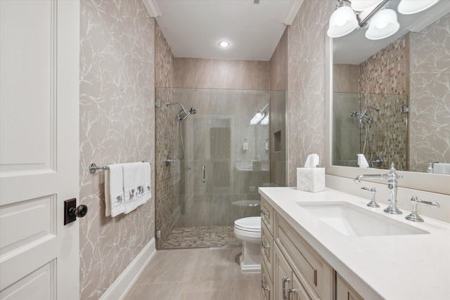 bathroom featuring vanity, toilet, and an enclosed shower