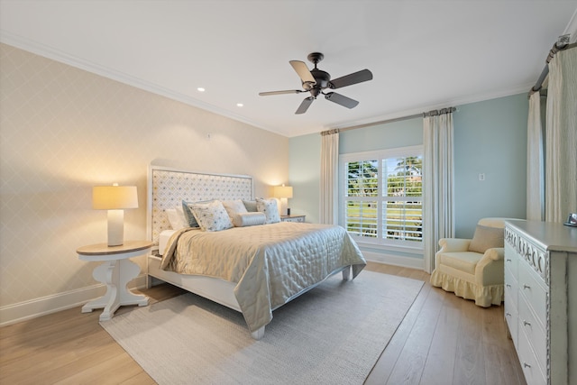 bedroom with crown molding, ceiling fan, and light hardwood / wood-style flooring