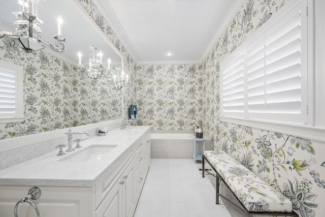 bathroom featuring a notable chandelier, crown molding, vanity, and a bathtub