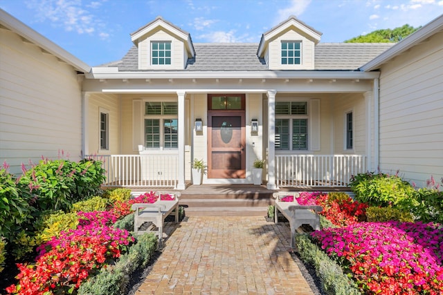 doorway to property featuring a porch