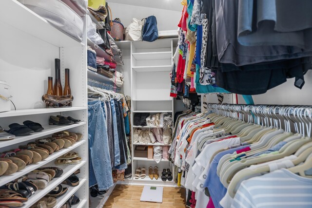 spacious closet featuring hardwood / wood-style flooring