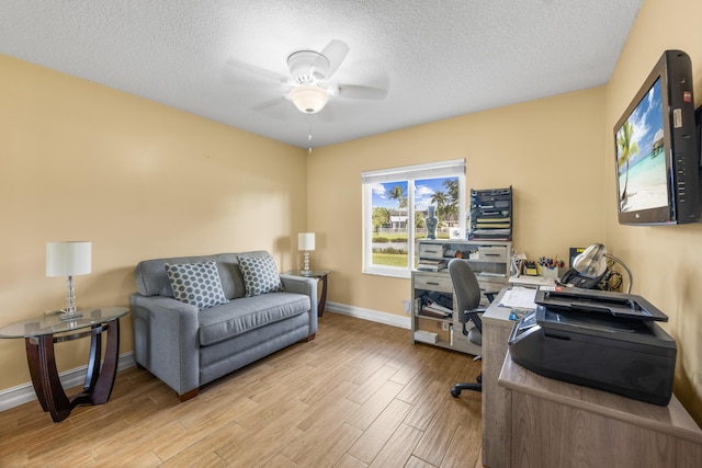 office featuring a textured ceiling and ceiling fan