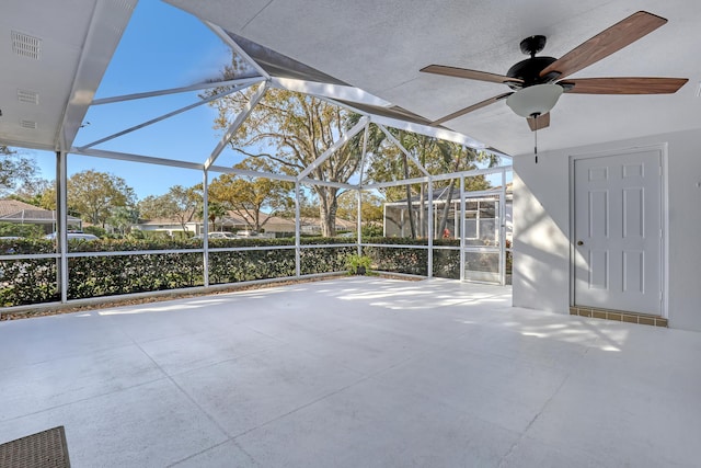 view of patio with a lanai and ceiling fan