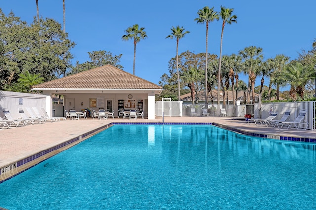 view of swimming pool with a patio