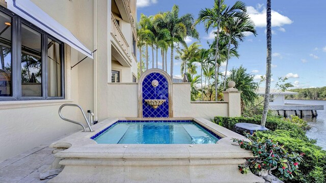 view of swimming pool featuring a gate