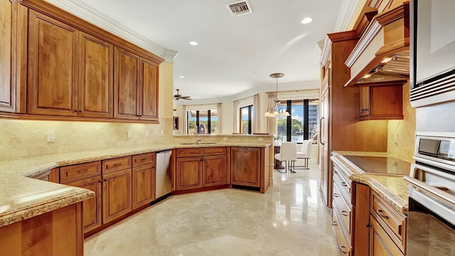 kitchen featuring a peninsula, premium range hood, brown cabinetry, and appliances with stainless steel finishes