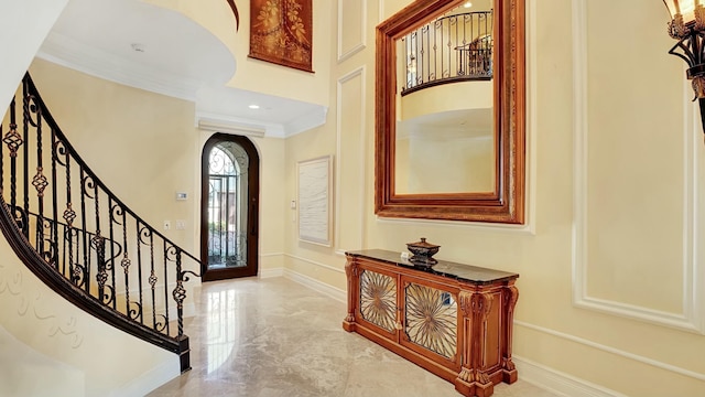 foyer featuring marble finish floor, recessed lighting, stairway, ornamental molding, and baseboards