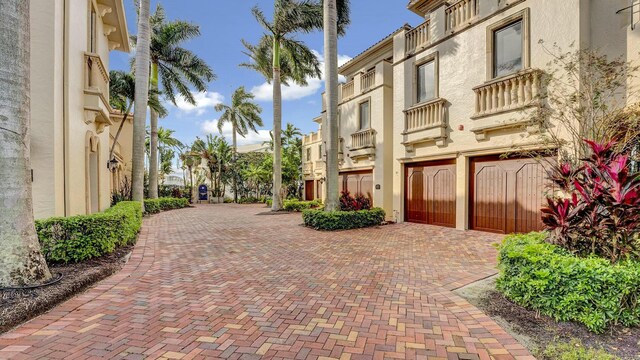 view of property featuring decorative driveway