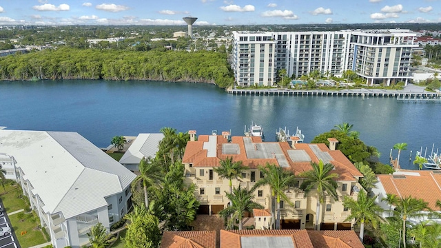 birds eye view of property with a water view