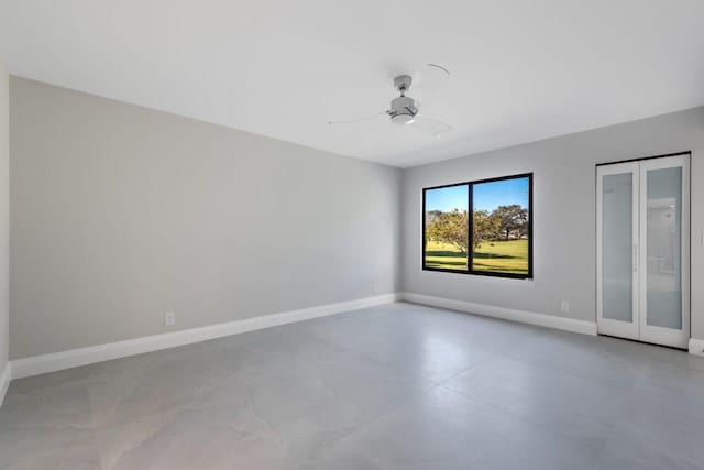 spare room featuring french doors and ceiling fan