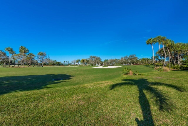 view of home's community featuring a lawn