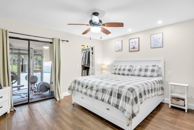 bedroom with a closet, ceiling fan, a spacious closet, and access to outside