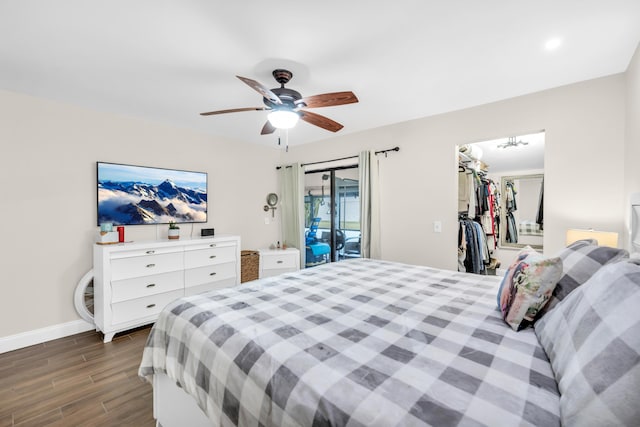 bedroom featuring a walk in closet, ceiling fan, and access to exterior