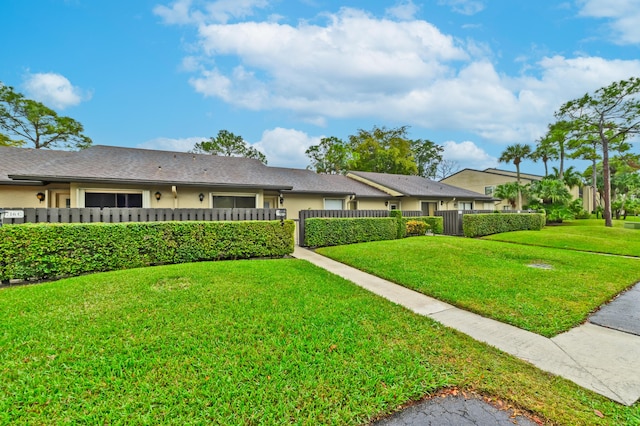 ranch-style home with a front yard