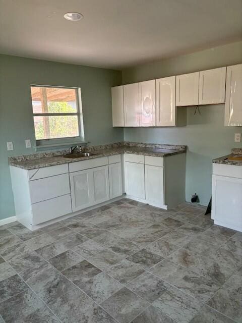 kitchen with sink and white cabinets