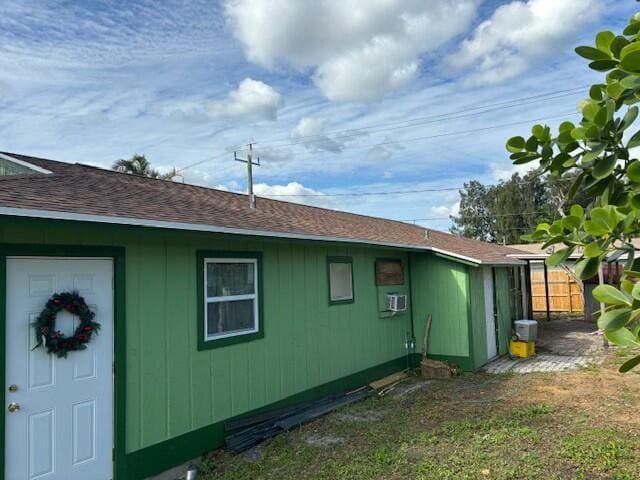 view of side of property with a yard