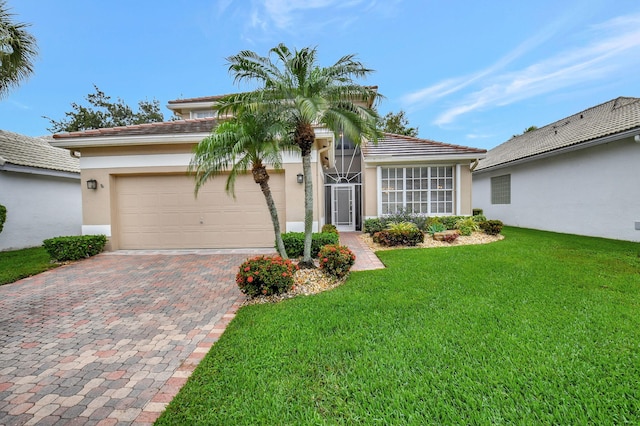 view of front of home featuring a garage and a front lawn