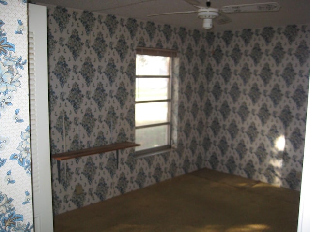 unfurnished room with ceiling fan