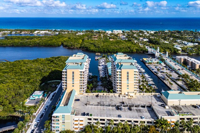 birds eye view of property with a water view