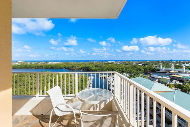 balcony featuring a water view