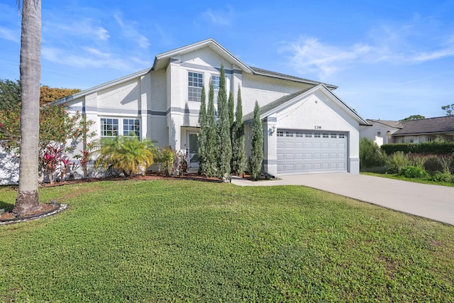 view of front of house with a garage and a front lawn