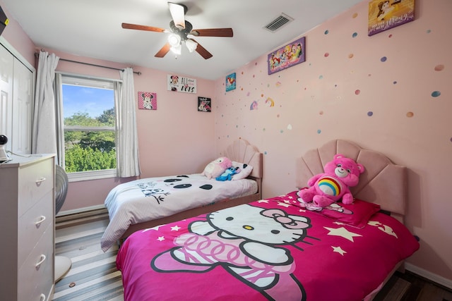 bedroom featuring ceiling fan and a closet