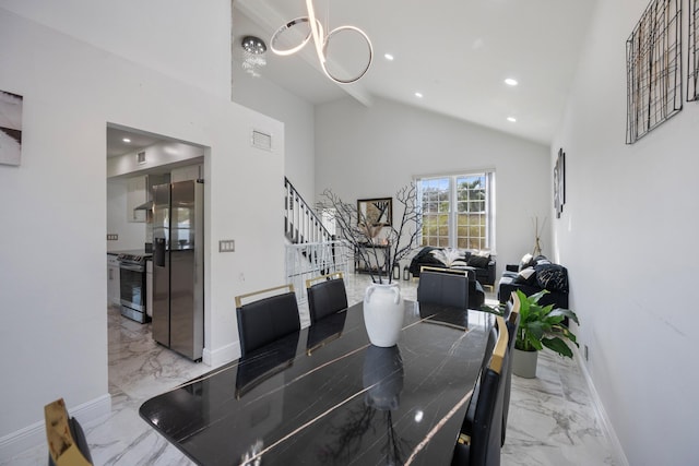 dining room featuring high vaulted ceiling