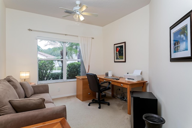 office area featuring light carpet and ceiling fan