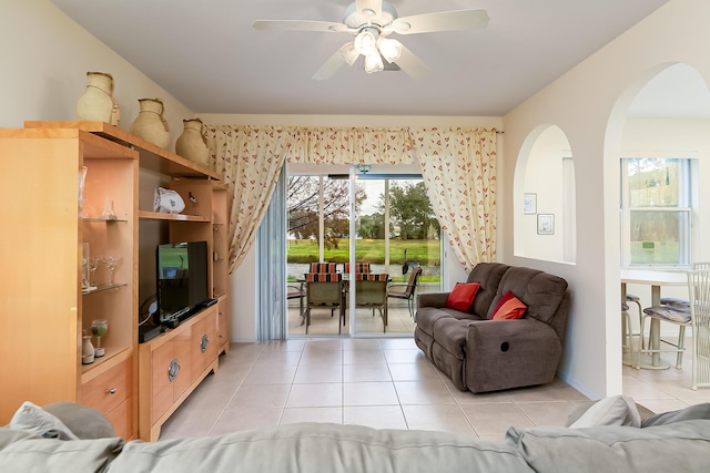 living room with ceiling fan and light tile patterned floors