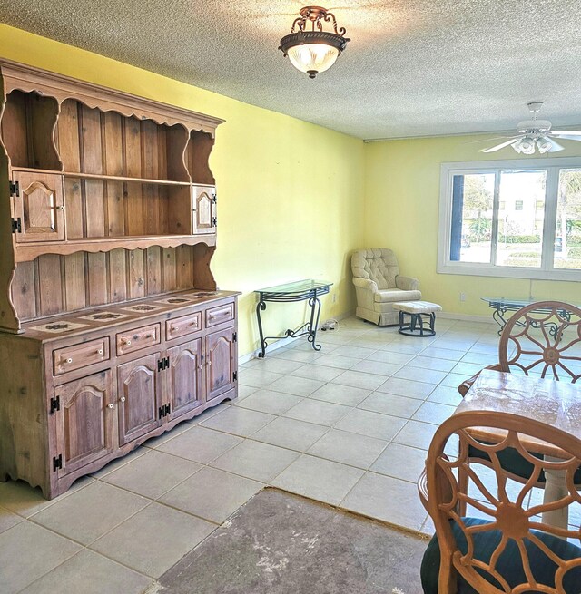 kitchen featuring sink, stainless steel appliances, white cabinets, and ceiling fan