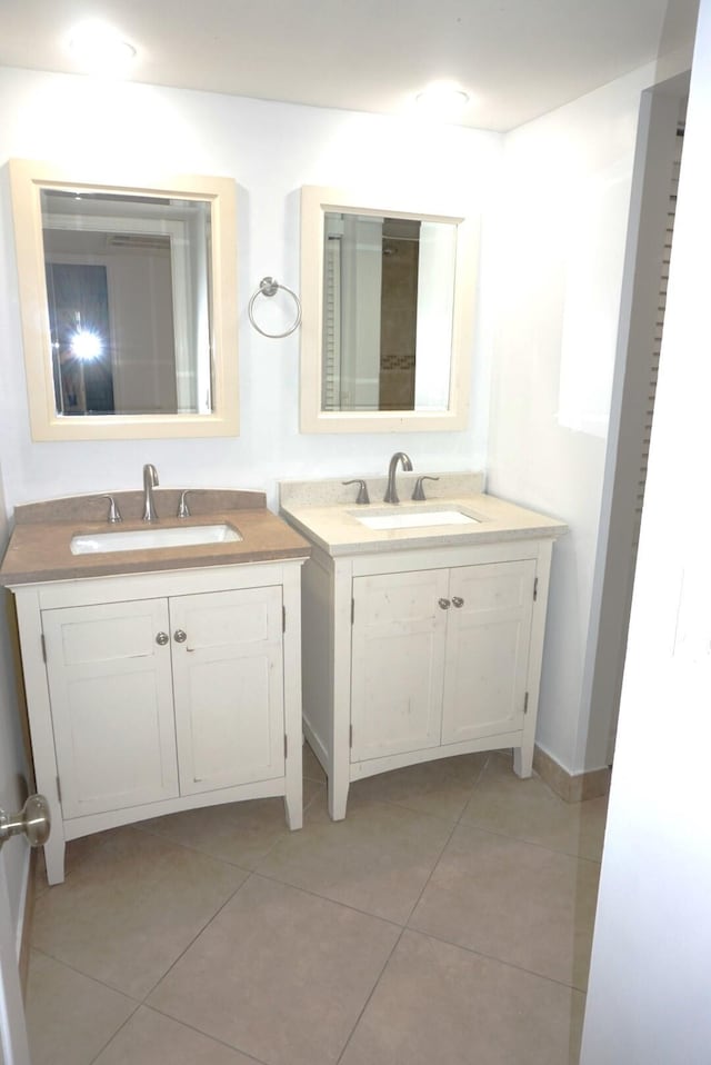 bathroom with tile patterned floors and vanity