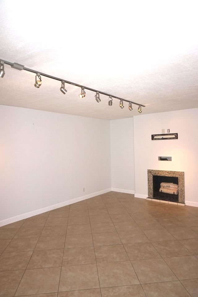 unfurnished living room featuring tile patterned flooring