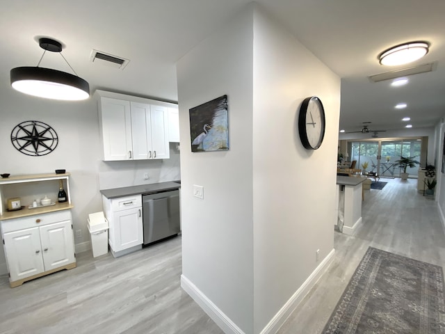 corridor with light hardwood / wood-style flooring