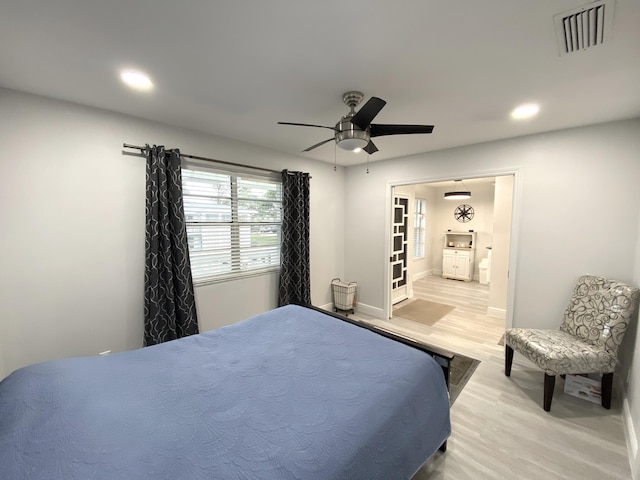 bedroom featuring ceiling fan and light hardwood / wood-style flooring