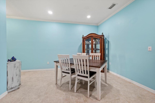 dining area featuring crown molding