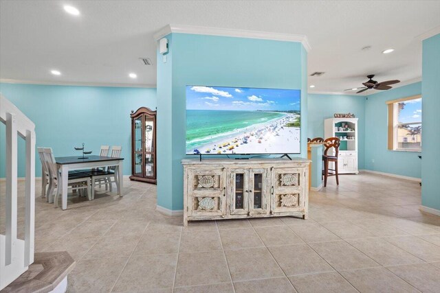 interior space featuring ornamental molding and light tile patterned floors