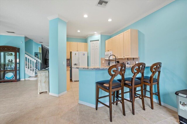 dining room with crown molding