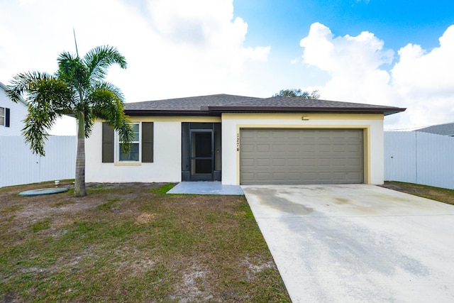 view of front of property with a garage