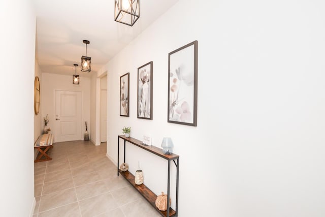 hall featuring light tile patterned floors