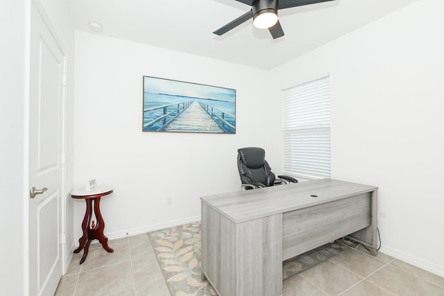 tiled office space featuring ceiling fan