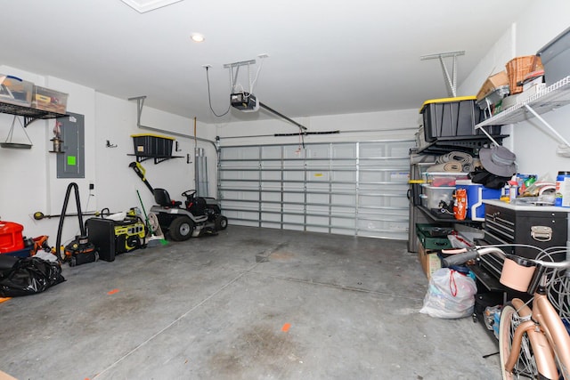 garage featuring a garage door opener and electric panel