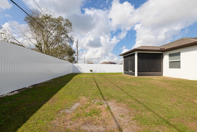 view of yard featuring a sunroom