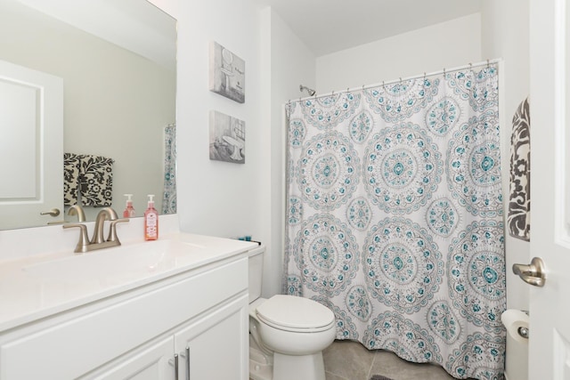 bathroom with vanity, tile patterned flooring, curtained shower, and toilet