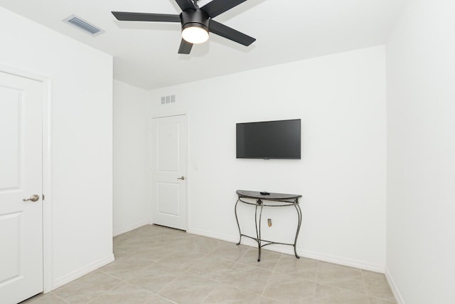 interior space featuring ceiling fan